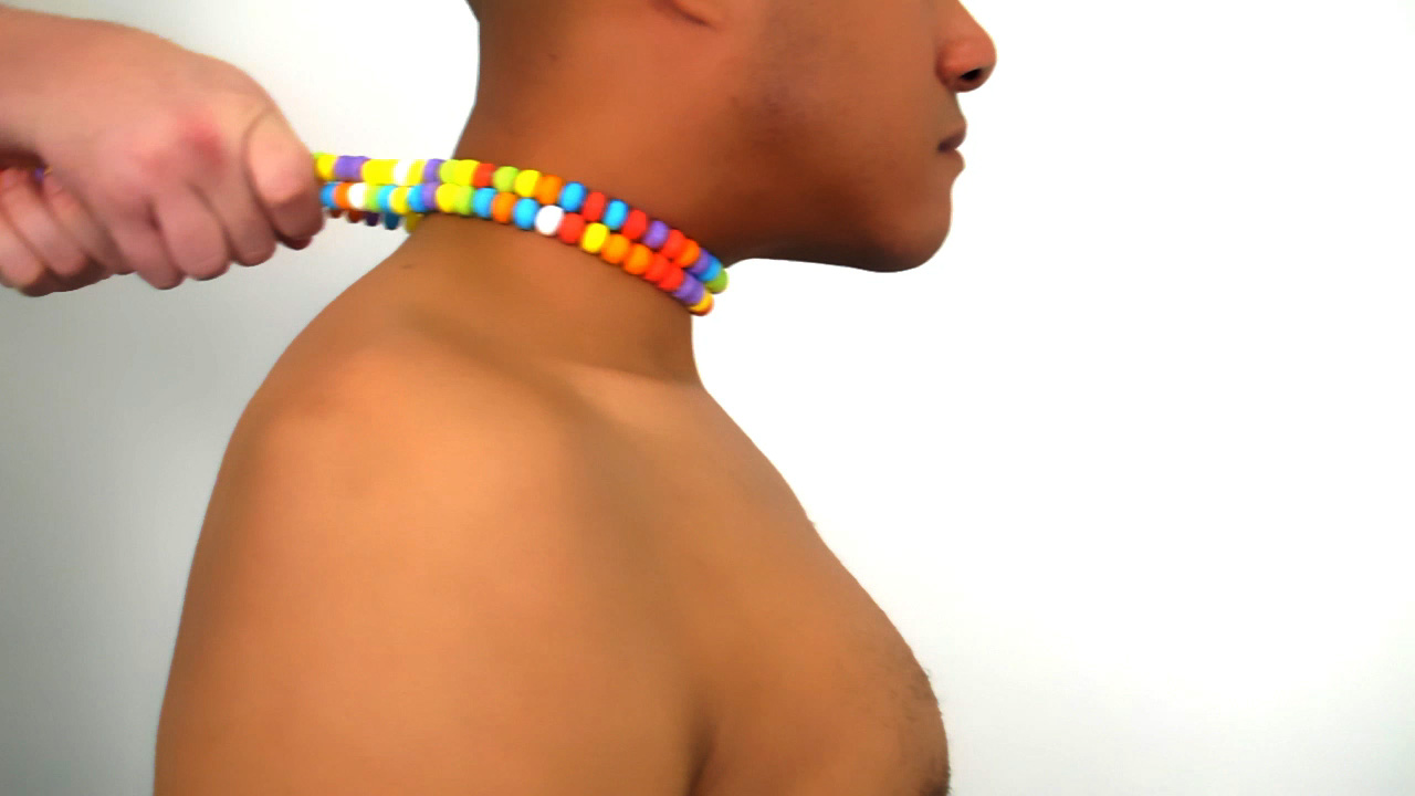 Still from Casual Cruelties: Rainbow Choker Video